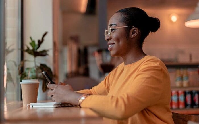 woman at coffee shop on phone